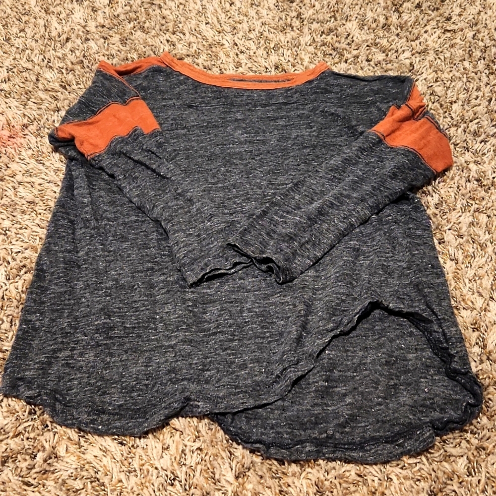I'm selling a long sleeve Grey and red shirt